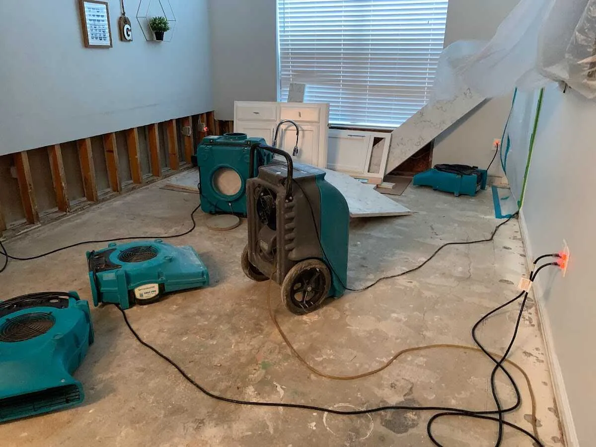 Dehumidifier in flood-cut room for Water Damage Restoration in Nashua